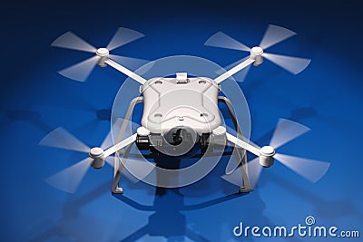 White drone with spinning propellers Stock Photo