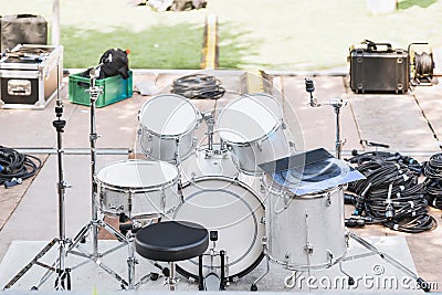 White drums and cymbals on an empty stage Stock Photo