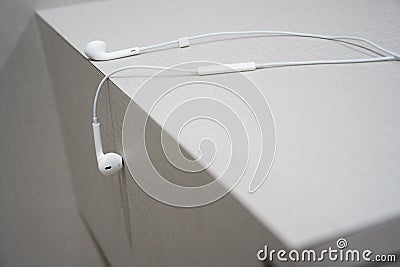 White earphone on the wooden table Stock Photo