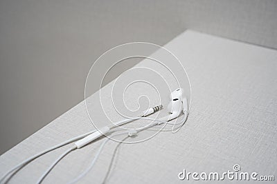 White earphone on the wooden table Stock Photo