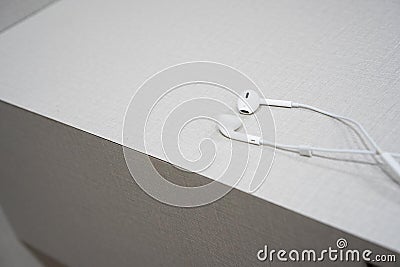 White earphone on the wooden table Stock Photo