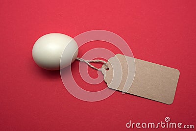 White egg price on red background Stock Photo