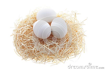 White Eggs on Straw Nest Stock Photo