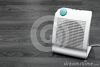 White electric heater on the floor Stock Photo