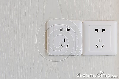 white electric plugs or outlet on wall Stock Photo