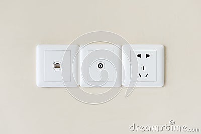 white electric plugs or outlet on wall, with tv and tel Stock Photo