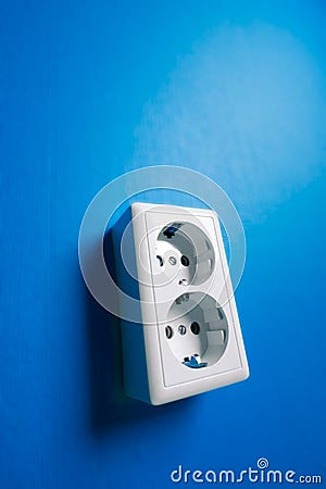 White electric socket on the wall. Stock Photo