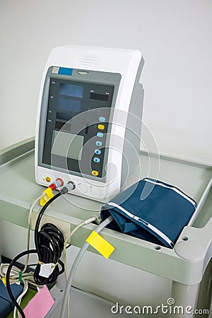 White electric tonometer on white table for measuring blood pres Stock Photo