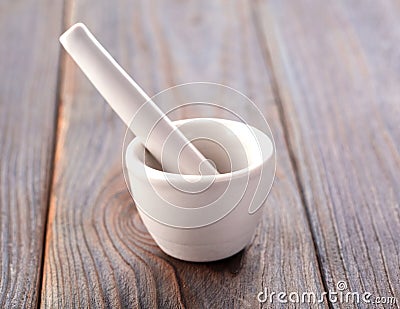 White empy mortar and pestles on old wooden background. Stock Photo