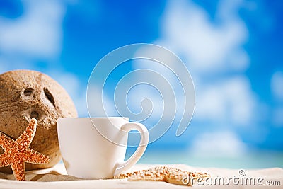 white espresso coffee cup with ocean , seashell, beach and seascape Stock Photo