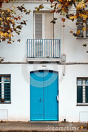 White facade with blue door, typical of the Spanish Mediterranean coast Stock Photo