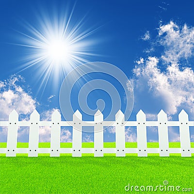 White fence on a summer lawn Stock Photo