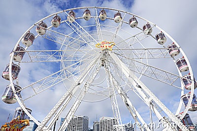 White ferris wheel with cloudy blue sky taken at Darling Harbour in Sydney Australia on 6 July 2016 Editorial Stock Photo