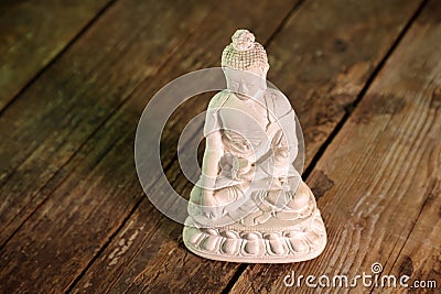 white figurine of the buddha of the fossil Stock Photo