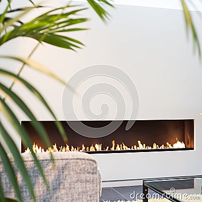 White fireplace modern design with green plant Stock Photo