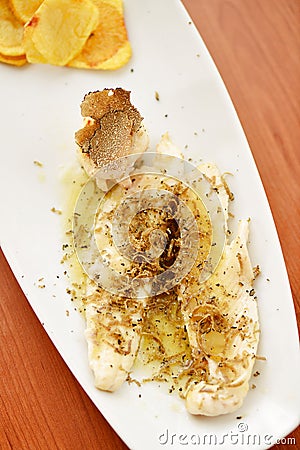 White fish fillet with black truffles Stock Photo