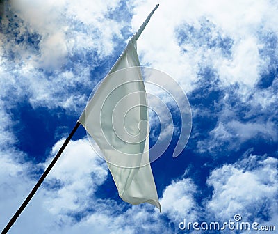 The white flag in the sky Surrender concept Stock Photo