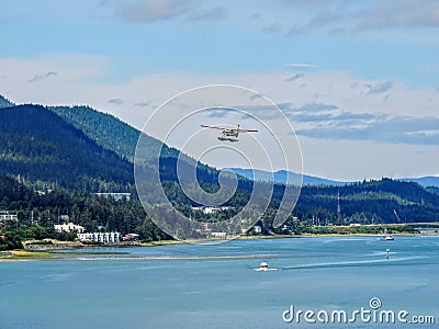 White Float Pontoon Seaplane Taking off from Juneau Harbor Stock Photo