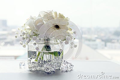 White flower beautiful in a clear glass vase, flower in vase for interior decoration office and home Stock Photo