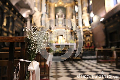 White flowers bench majestic architecture catholic cathedral Editorial Stock Photo