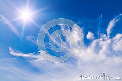 White fluffy clouds over blue sky Stock Photo