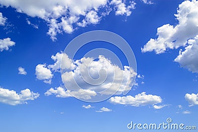 White fluffy cumulus clouds high in the blue summer sky. Cloud types and atmospheric phenomena. On a sunny day Stock Photo