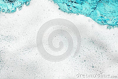 White foam blue water background closeup, sea or ocean foam wave pattern, froth bubbles texture, soap spume backdrop, soap sud Stock Photo