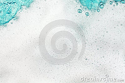 White foam blue water background closeup, sea or ocean foam wave pattern, froth bubbles texture, soap spume backdrop, soap sud Stock Photo