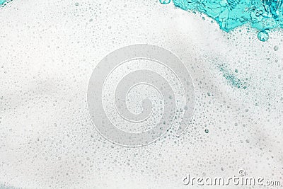 White foam blue water background closeup, sea or ocean foam wave pattern, froth bubbles texture, soap spume backdrop, soap sud Stock Photo