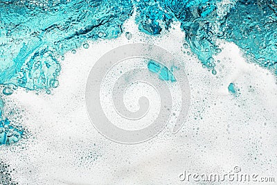 White foam blue water background closeup, sea or ocean foam wave pattern, froth bubbles texture, soap spume backdrop, soap sud Stock Photo