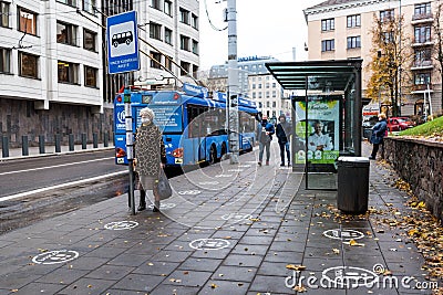 White footprints marked sign on the footpath at the bus stop Editorial Stock Photo