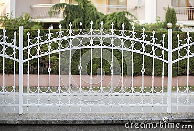 White forged iron fence Stock Photo