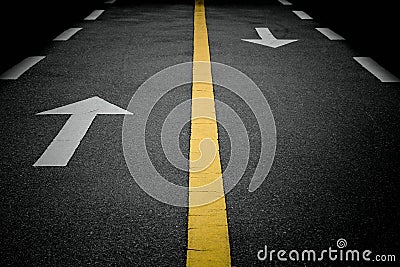 White forward arrow signs on the road. Stock Photo