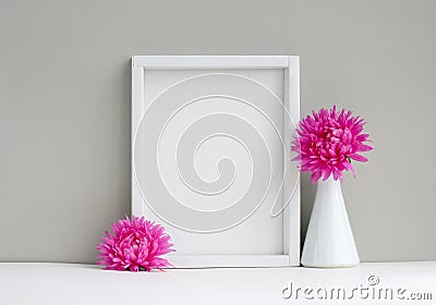 White frame mock-up, empty layout, vase with pink aster Stock Photo