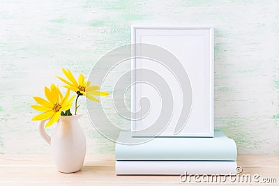 White frame mockup with two deep yellow rosinweed and books Stock Photo