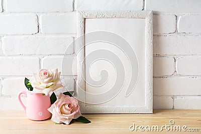 White frame mockup with two pale pink roses Stock Photo