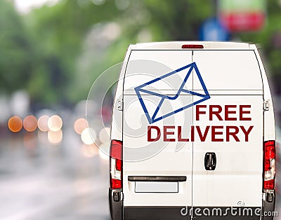 White free delivery Van driving fast on city blurr bokeh street Stock Photo