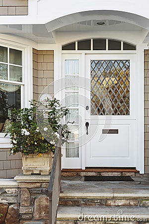 White front door of upscale beige home Stock Photo