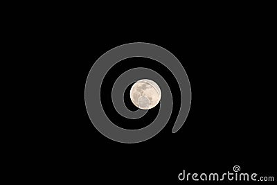 white full moon with craters in black sky with no stars Stock Photo