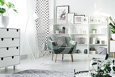 White furniture and green armchair Stock Photo