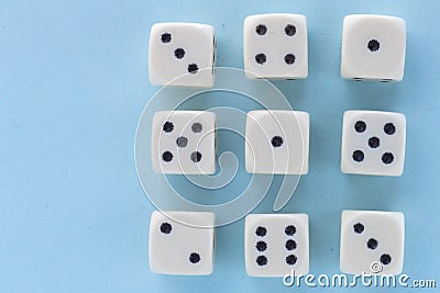 White gaming dices on light blue background. victory chance and lucky. Flat lay style, place for text. Top view and Close-up cube Stock Photo