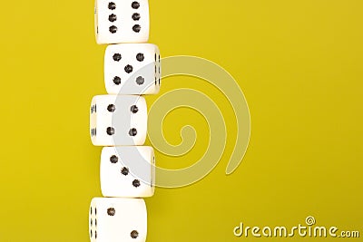 White gaming dices on yellow background. Victory chance and lucky. Place for text. Top view and Close-up cube. Concept business, Stock Photo