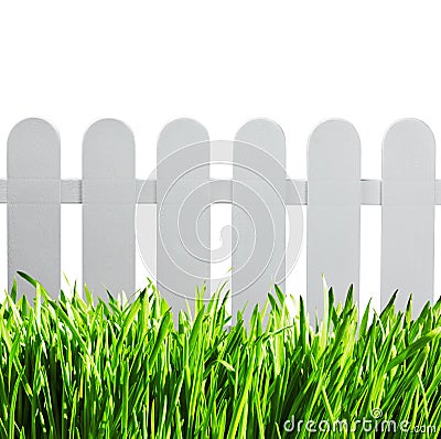 White garden fence and green grass Stock Photo