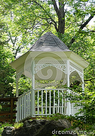 A white gazebo surrounded by green trees near Blue Spring Heritage Center, Eureka Springs, Arkansas, U.S Stock Photo