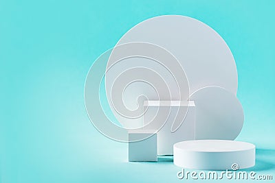 White geometric shapes podium for product display on blue background. Monochrome stage, stand for product promotion in Stock Photo