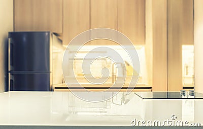 White glossy counter top and blur kitchen room background Stock Photo