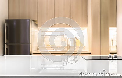 White glossy countertop and on blur kitchen room background Stock Photo