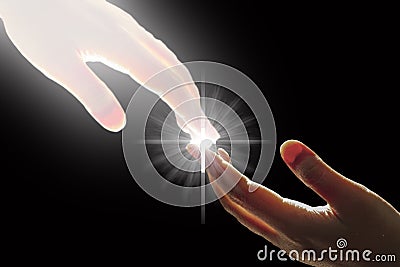 White God`s Hand is Touching The Hand with Cross Stock Photo