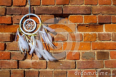 White and gold dreamcatcher dangling Stock Photo