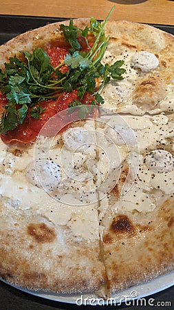 A white gourmet pizza freshly served Stock Photo